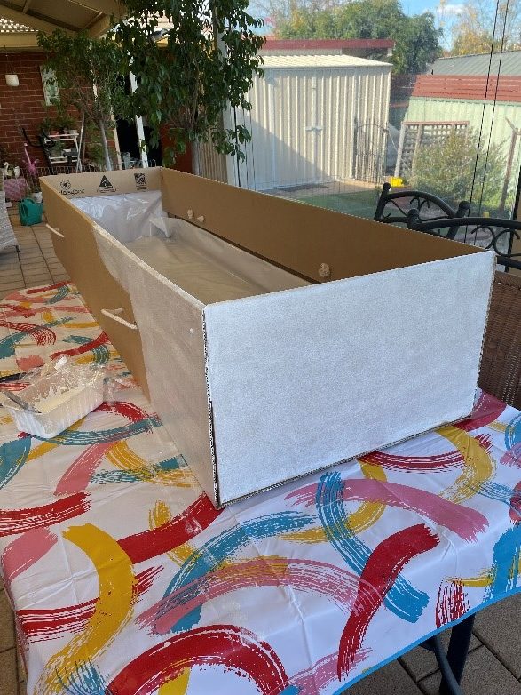 Doing first undercoat of white gesso paint (a low toxic chalk style paint) on my eco-cardboard coffin