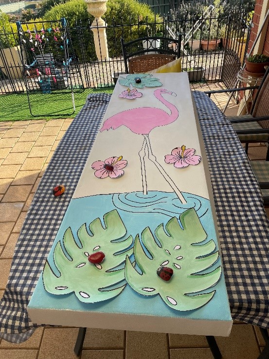 Decorating the eco-cardboard coffin with illustrations and decoupage