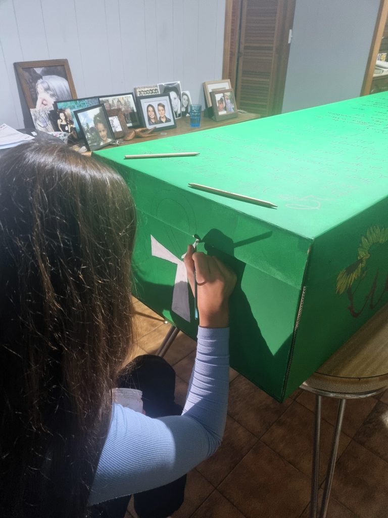 With a bit of help from my family to decorate my eco coffin