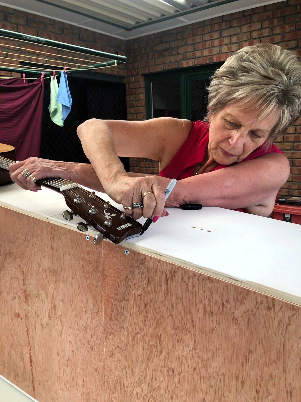 eco coffin decorating - tracing guitar outline