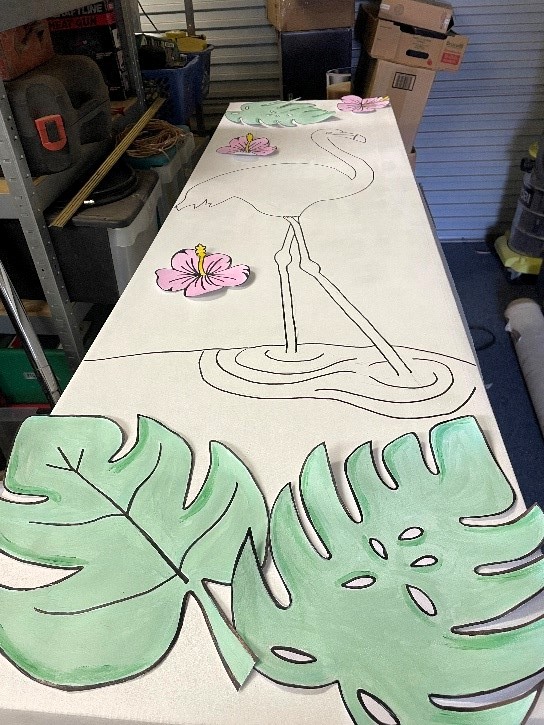 Decorating the eco-cardboard coffin with illustrations and decoupage