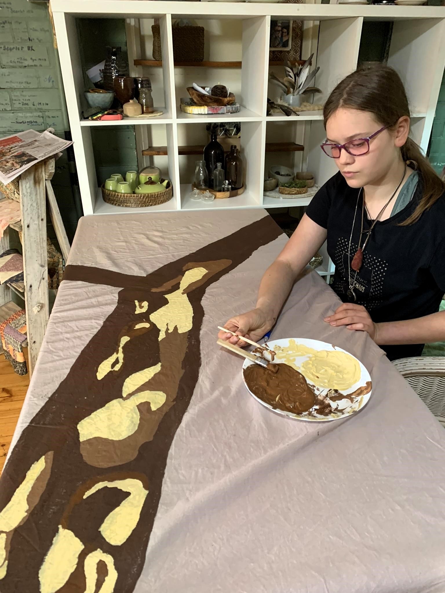 shroud making - painting calico material hand-dyed with red wine from parent's wedding