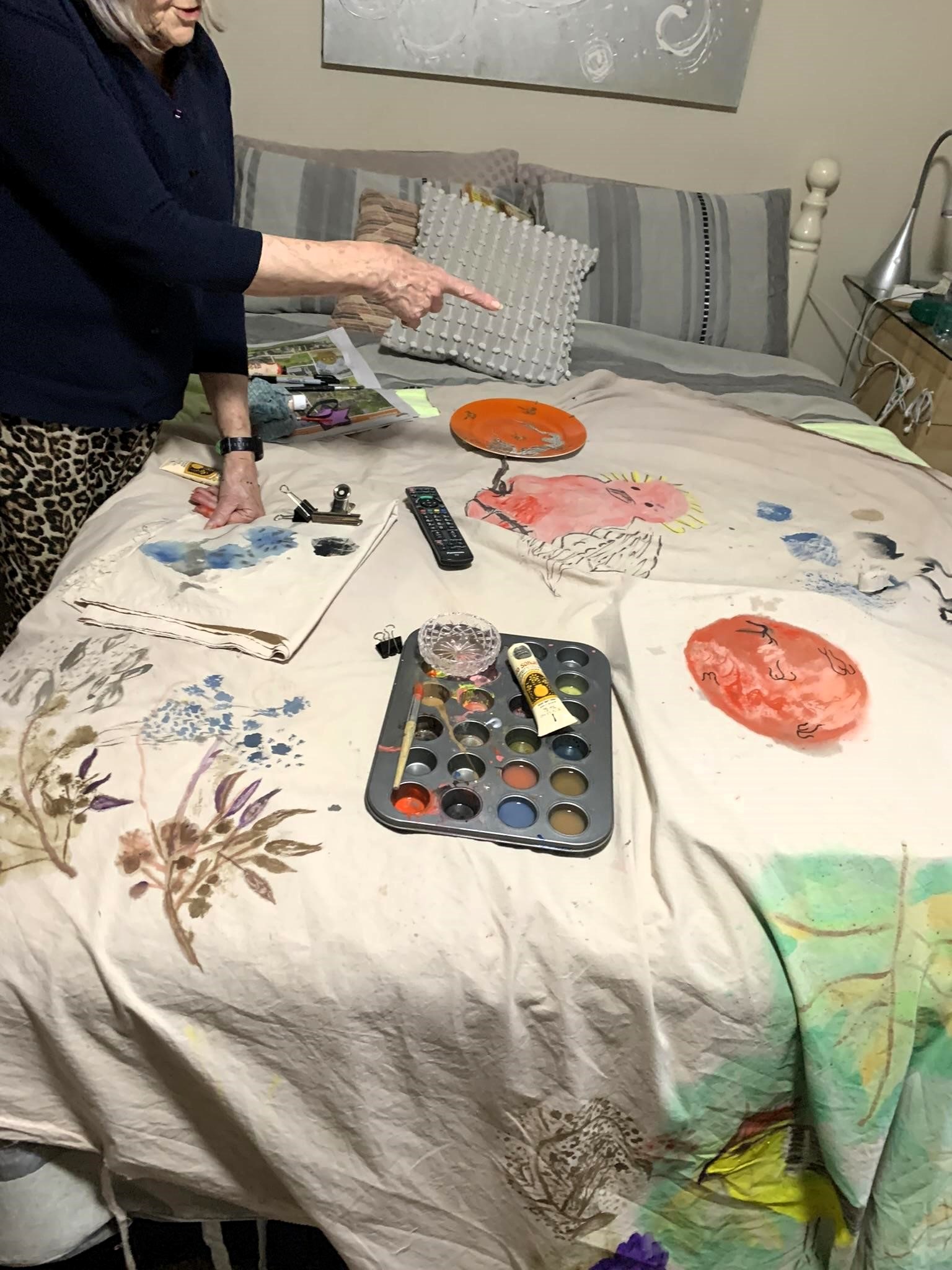 shroud making - painting life stories onto calico material