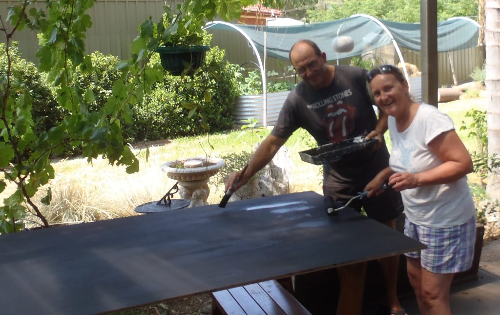 Painting the panels with black chalkboard paint for the Before I Die mobile trailer