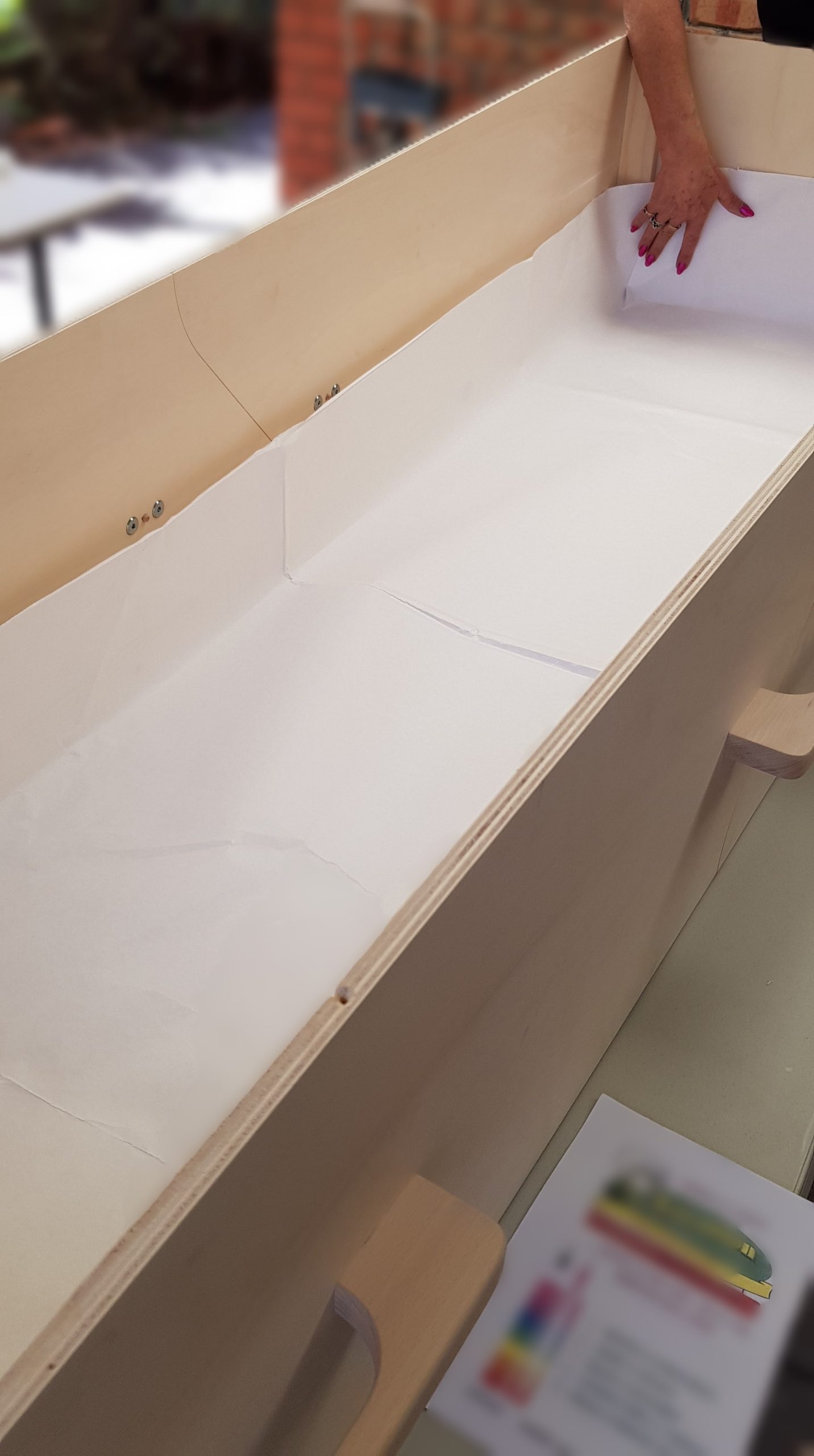 The treated paper liner was added to the base of the eco-coffin