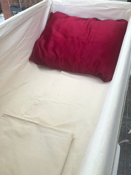 Favourite red pillow added to eco coffin