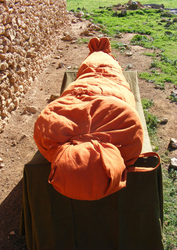 Ochre linen/cotton shroud setup for display